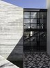 Modern home with Outdoor, Side Yard, Concrete Patio, Porch, Deck, Metal Fences, Wall, and Landscape Lighting. Courtyard Photo 7 of Pia Residence