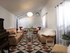 Modern home with Living Room, Ceramic Tile Floor, Sofa, Chair, Lamps, Ceiling Lighting, Coffee Tables, and Console Tables. Living Room Photo 6 of Pia Residence