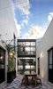 Modern home with Outdoor, Metal Fences, Wall, Side Yard, Concrete Patio, Porch, Deck, and Landscape Lighting. Courtyard- Social area Photo 3 of Pia Residence
