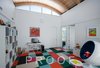 Modern home with Kids Room, Bookcase, Chair, Playroom Room Type, Neutral Gender, and Toddler Age. Playroom based on the Miller House in Columbus, Indiana. Photo 4 of The Schechter House