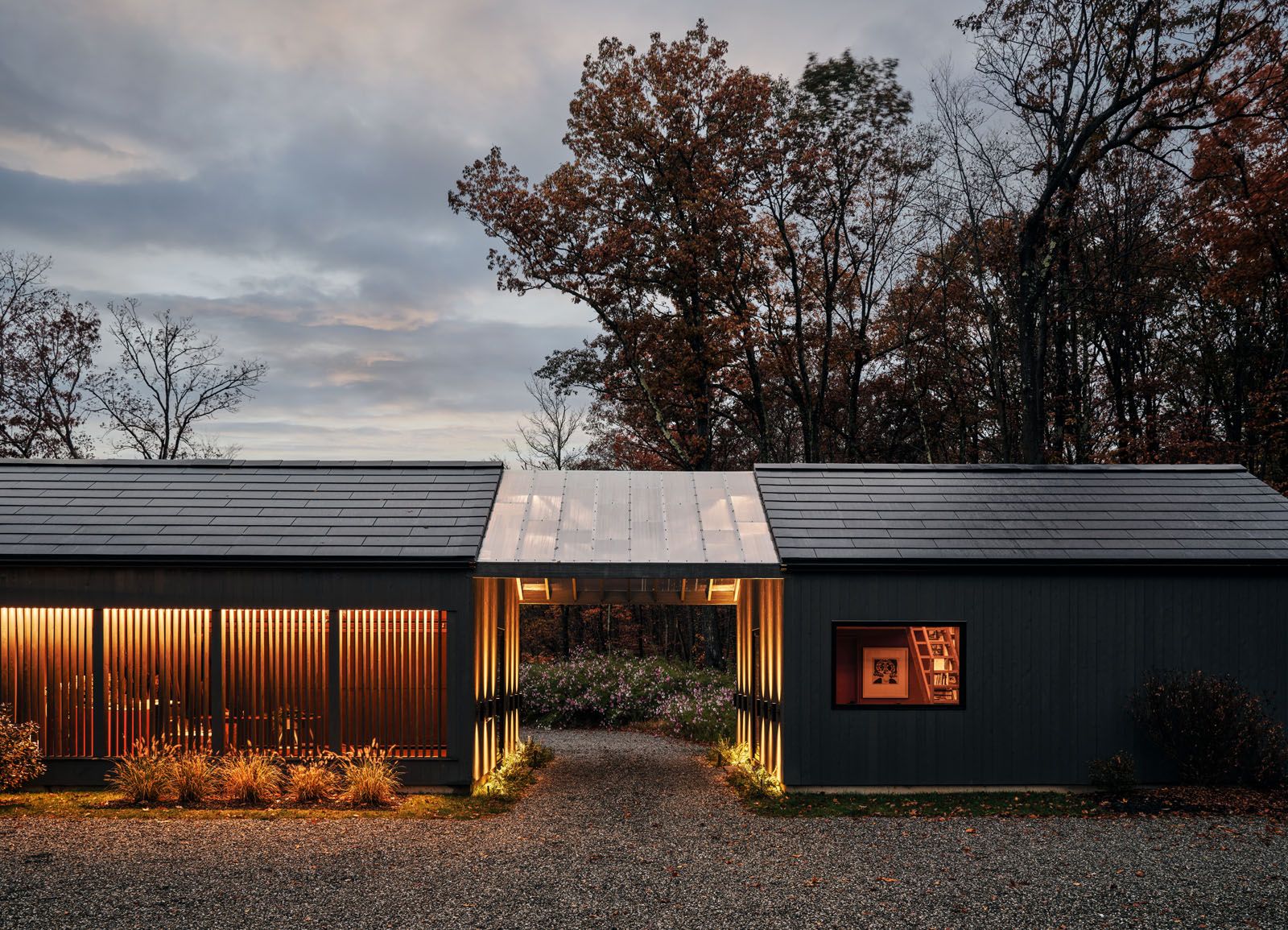 Exterior view of the drive through to the interior courtyard, wild flowers beyond