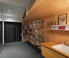The owners are avid cyclists, generally coming and going by bicycle. A second entrance provides direct access to a lower level with spacious bicycle storage, wash area, and plenty of closet space. Photo 16 of Bellwoods Lodge modern home