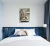Modern home with Bedroom, Night Stands, Floor Lighting, and Bed. Bedroom with a velvet headboard Photo 19 of Lady