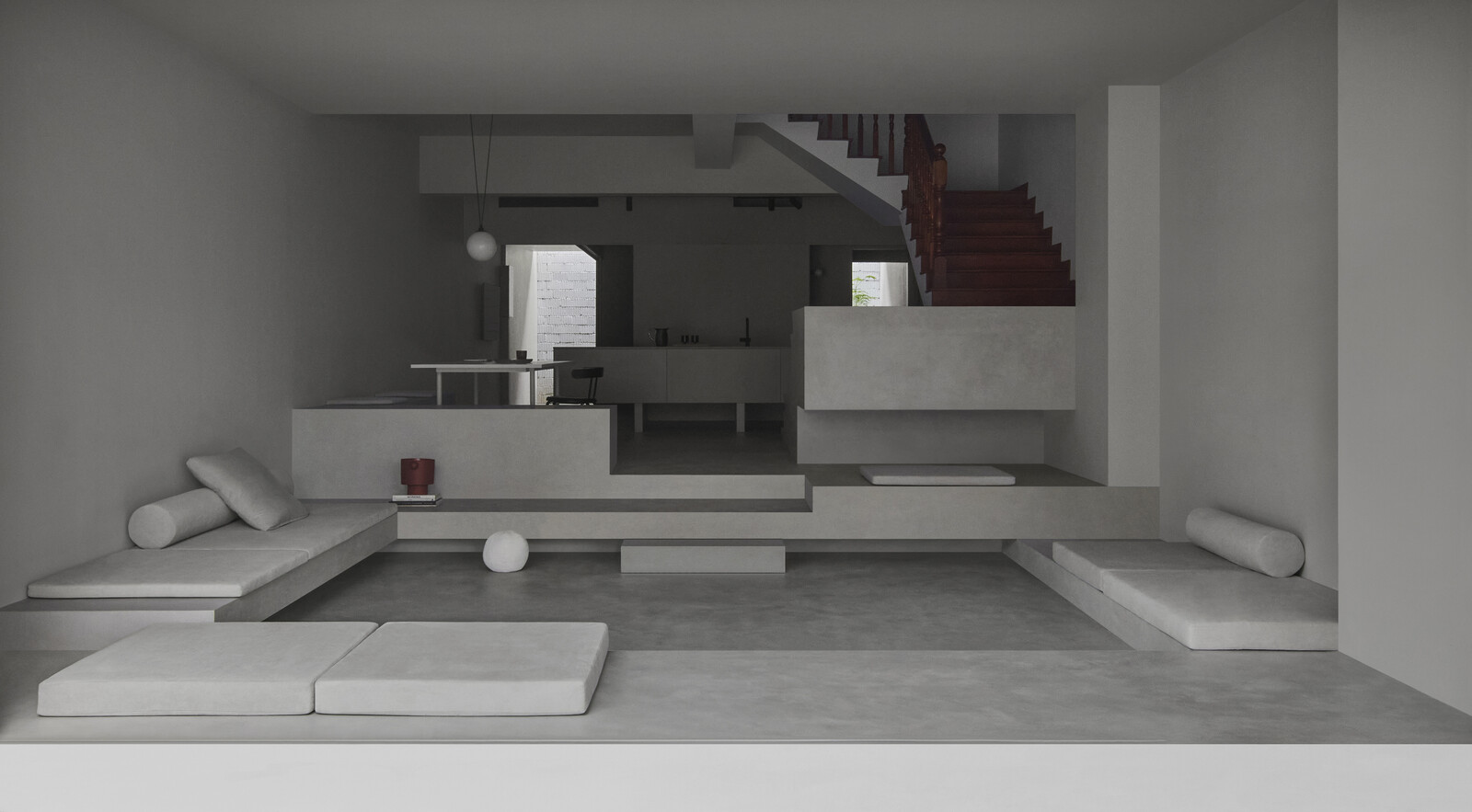 The entire first storey facade was opened up to the front. The designer used the colour grey to create a homogeneous space made up of various structural elements, heights and depths. 