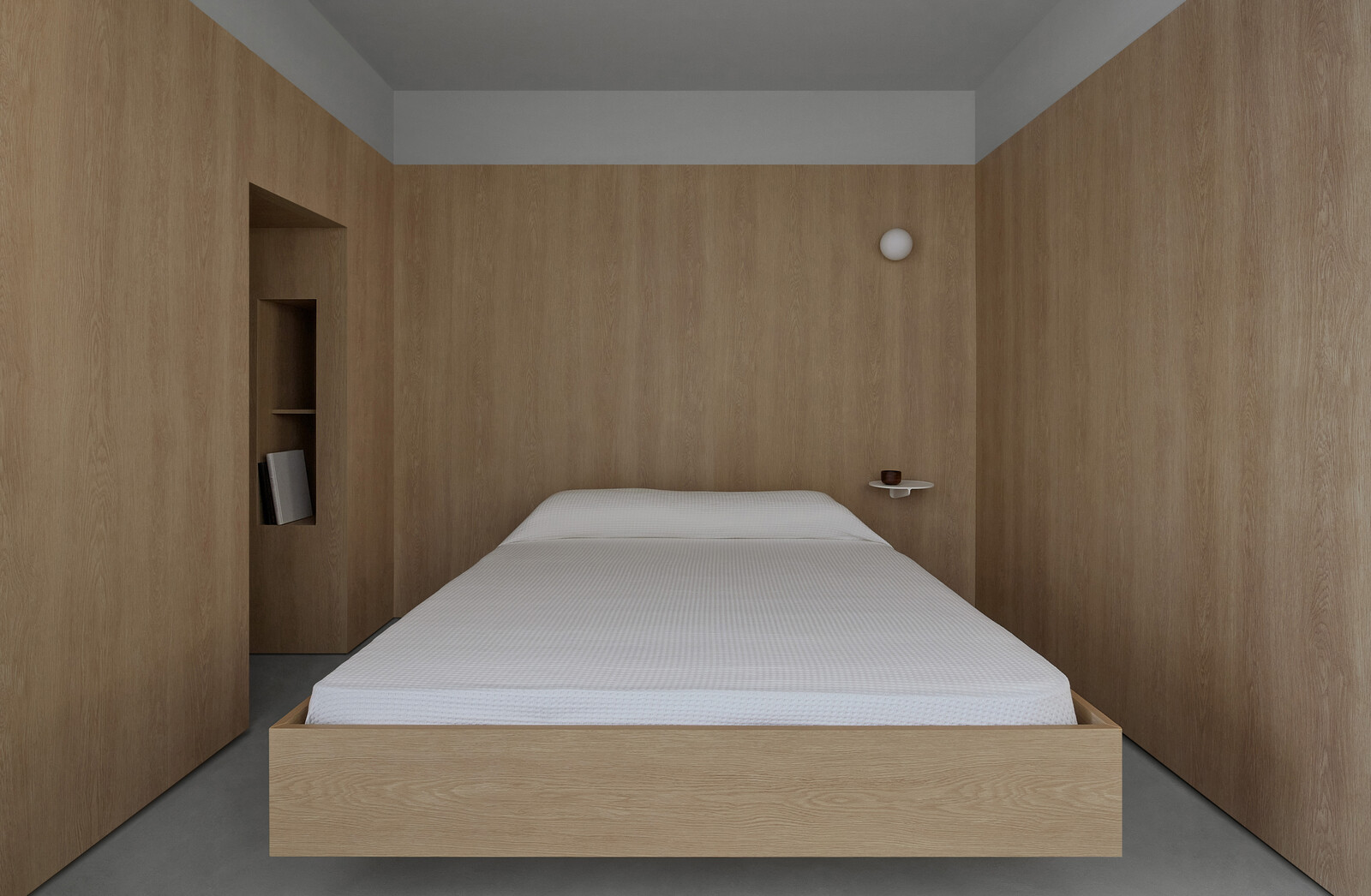 The guestroom on the first storey, with a small walk-in wardrobe. 