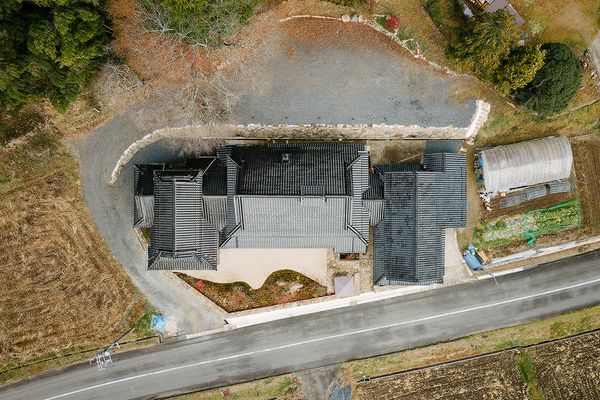 From left: the former cattle barn (now guesthouse), the main house and annex.
