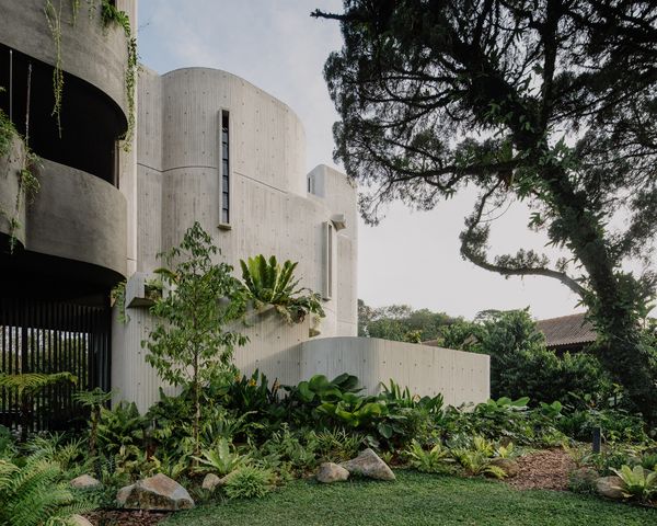 The off-form concrete corner that was left unpainted contains the staircase. 