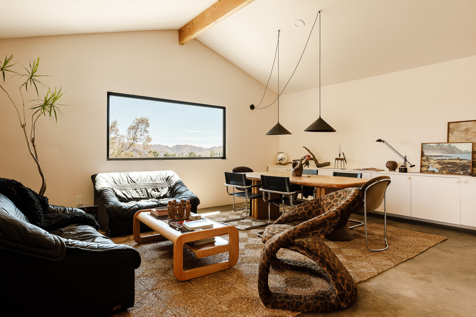 Converting the garage to a creative office gave the couple much more usable interior space. The room doubles as a lounge and dining room.