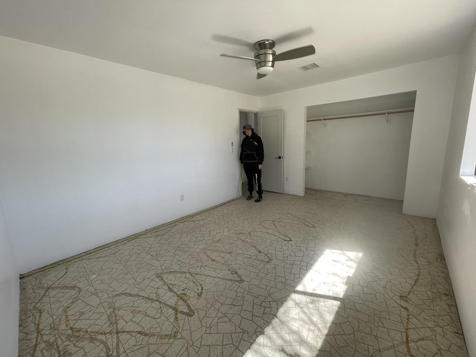 Before: The primary bedroom lacked personality with flooring that needed to be replaced.