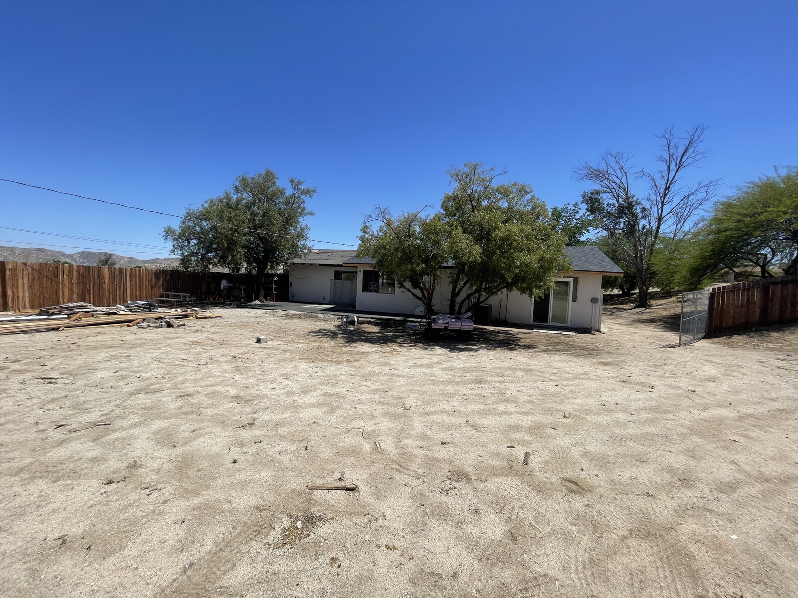 Before: The backyard was very exposed with few places for respite from the desert sun.