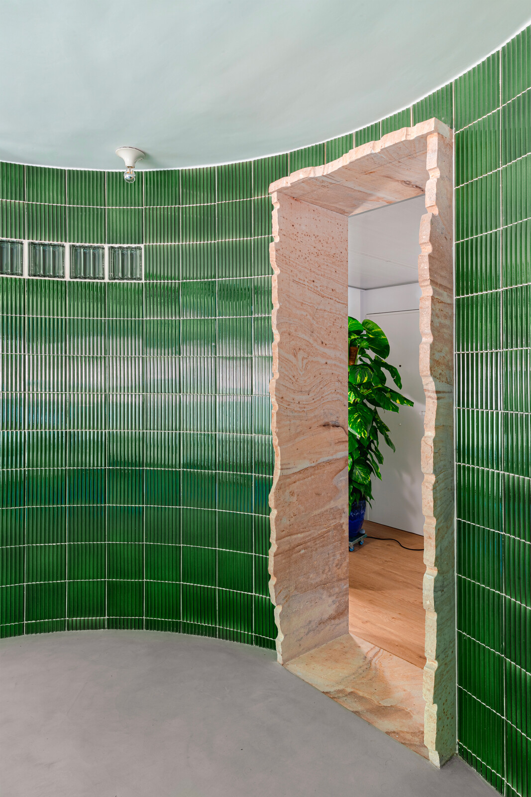 A key intervention in the space was the addition of a curved wall just off the entrance. "We like doing curved things that are not sharply defined,