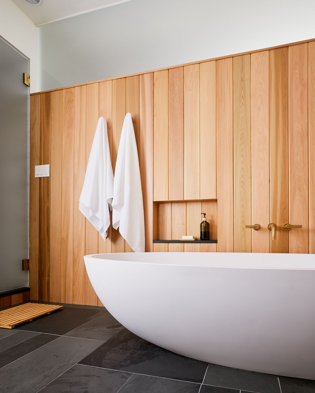 The tub in the primary bath is by Agape with a faucet from Watermark.