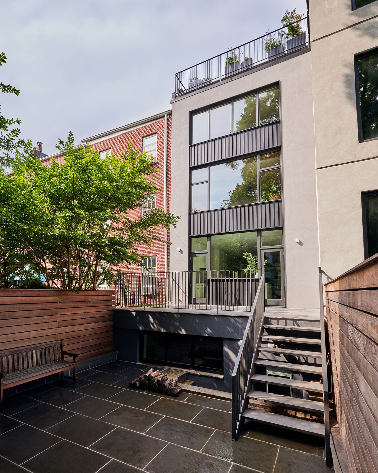 The townhouse had a small addition at the back which was added in the 1960s, but the designers decided to remove it in favor of creating an outdoor deck right off the relocated kitchen.