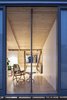 Modern home with Exterior, House Building Type, Metal Roof Material, and Metal Siding Material. Rear facade sliding doors slide past the exterior cladding. Photo 9 of Arklow Villa III