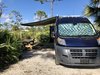 Modern home with Exterior, Camper Building Type, and Tiny Home Building Type. A large awning doubles the living space. Photo 15 of The Pennybago