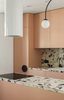 Modern home with Kitchen, Tile Counter, Wall Lighting, Colorful Cabinet, and Ceramic Tile Backsplashe. Kitchen set Photo of Apartment, 62 sq. meters in St. Petersburg
