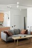 Modern home with Living Room, Sofa, Ceiling Lighting, Wall Lighting, Coffee Tables, and Medium Hardwood Floor. Livingroom Photo 5 of Apartment, 62 sq. meters in St. Petersburg
