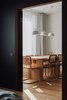 Modern home with Dining Room, Chair, Pendant Lighting, Medium Hardwood Floor, and Table. Dinner zone Photo 15 of Apartment, 62 sq. meters in St. Petersburg