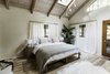Modern home with Bedroom, Bed, Track Lighting, and Light Hardwood Floor. we love waking up in the trees! Photo 7 of Bonny Doon Forest Temple