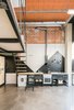 Modern home with Kitchen, Drop In Sink, Range Hood, Concrete Floor, Metal Cabinet, and Cooktops. The kitchen tiling was selected as it was the least expensive on the market, and a graphic arrangement of the tiles creates an interesting focal point. Photo 3 of #UPHouse