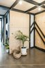 Modern home with Doors, Wood, Interior, and Sliding Door Type. The renovation was completed on a tight budget, made possible by the use of low-cost and recycled materials throughout the interior. The steel structure supporting the mezzanine is left exposed, creating a graphic feature. Photo 7 of #UPHouse