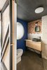 Modern home with Bath Room, Wood Counter, Open Shower, Concrete Floor, Ceramic Tile Wall, and Ceiling Lighting. #UPHouse bathroom_ cumulolimbo studio Photo 9 of #UPHouse