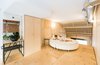 The most intimate and restricted area of the apartment is the bedroom on the new mezzanine floor. Over 100 recycled plywood lids were used as cladding in the downstairs studio—the wall of which continues into the bedroom—and for the bedroom floor. Photo 12 of #UPHouse modern home