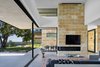 Modern home with Living Room, Concrete Floor, Coffee Tables, Chair, Sectional, and Gas Burning Fireplace. Lago Vista by Dick Clark + Associates Photo 2 of Lago Vista