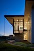 Modern home with Exterior, House Building Type, Stone Siding Material, Metal Siding Material, Metal Roof Material, Glass Siding Material, Stucco Siding Material, and Gable RoofLine. Lago Vista by Dick Clark + Associates Photo 5 of Lago Vista
