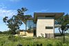 Modern home with Exterior, House Building Type, Glass Siding Material, Gable RoofLine, Hipped RoofLine, Metal Roof Material, Stone Siding Material, and Stucco Siding Material. Lago Vista by Dick Clark + Associates Photo 6 of Lago Vista