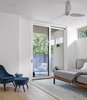 Modern home with Bedroom, Light Hardwood Floor, Chair, Bed, and Ceiling Lighting. 007 House by Dick Clark + Associates Photo 6 of 007 House