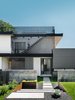 Modern home with Outdoor, Stone Patio, Porch, Deck, Metal Fences, Wall, Shrubs, Hardscapes, Horizontal Fences, Wall, Small Patio, Porch, Deck, Grass, Concrete Fences, Wall, Walkways, Concrete Patio, Porch, Deck, and Front Yard. 007 House by Dick Clark + Associates Photo 2 of 007 House