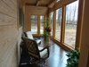 Modern home with Windows, Picture Window Type, Wood, and Sliding Window Type. Basement level of the AQ-1 tower sunspace Photo 2 of Aquarius 1 Mass Timber Geo-Solar home by Enertia®