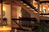 Modern home with Staircase, Wood Tread, and Glass Railing. Stairs, with tempered glass balusters. The lower stairs go to the walk-out finished basement Photo 5 of Aquarius 1 Mass Timber Geo-Solar home by Enertia®