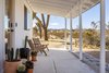 Modern home with Outdoor, Front Yard, Trees, Shrubs, Large Patio, Porch, Deck, and Desert. After: The Front Porch Photo 4 of Mojave Mesa House