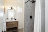 Modern home with Engineered Quartz Counter, Undermount Sink, Ceiling Lighting, Porcelain Tile Floor, and Recessed Lighting. After: Bathroom Photo 16 of Mojave Mesa House