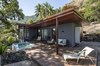 Modern home with Outdoor, Front Yard, Stone Patio, Porch, Deck, Gardens, Landscape Lighting, Metal Patio, Porch, Deck, Concrete Pools, Tubs, Shower, Wood Patio, Porch, Deck, Wood Fences, Wall, Concrete Patio, Porch, Deck, Small Pools, Tubs, Shower, Trees, and Decking Patio, Porch, Deck. designed by Estúdio Minke Photo 2 of Casa da Pedra (The stone house)