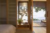 Modern home with Bedroom, Bed, Bench, Ceramic Tile Floor, Shelves, Dresser, Porcelain Tile Floor, and Wardrobe. designed by Estúdio Minke Photo 5 of Casa da Pedra (The stone house)