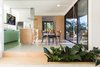 Modern home with Kitchen, Ceramic Tile Floor, Cooktops, Wood Cabinet, Refrigerator, Porcelain Tile Floor, Colorful Cabinet, Ceramic Tile Backsplashe, and Quartzite Counter. designed by Estúdio Minke Photo 7 of Casa da Pedra (The stone house)