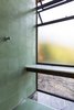 Modern home with Bath Room, Marble Counter, Ceramic Tile Floor, Open Shower, Porcelain Tile Wall, Porcelain Tile Floor, Stone Tile Wall, and Floor Lighting. designed by Estúdio Minke Photo 9 of Casa da Pedra (The stone house)