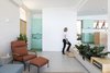 Modern home with Living Room, Wall Lighting, Chair, Sofa, Ceramic Tile Floor, Ceiling Lighting, Porcelain Tile Floor, and Recliner. designed by Estúdio Minke Photo 14 of Casa da Pedra (The stone house)