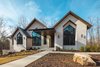 Modern home with Exterior, House Building Type, Stone Siding Material, A-Frame RoofLine, and Metal Roof Material. Exterior Athens Home Photo of Athens Home