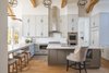 Modern home with Kitchen, Range Hood, Ceiling Lighting, Refrigerator, Microwave, Wall Oven, Mosaic Tile Backsplashe, Undermount Sink, Range, Medium Hardwood Floor, White Cabinet, and Pendant Lighting. Athens Kitchen Photo 3 of Athens Home