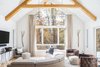 Modern home with Living Room, Chair, Medium Hardwood Floor, Pendant Lighting, Sofa, Console Tables, Sectional, Ottomans, Ceiling Lighting, and End Tables. Athens Living Room Photo 6 of Athens Home