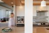 Modern home with Kitchen, Granite Counter, White Cabinet, Stone Slab Backsplashe, Accent Lighting, Recessed Lighting, Ceiling Lighting, and Pendant Lighting. Open kitchen & dining Photo 4 of Scott Residence