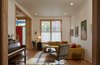 Modern home with Living Room, Table, Medium Hardwood Floor, Ceiling Lighting, End Tables, Sectional, and Rug Floor. Living room. Photo 5 of Drake House