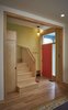 Modern home with Staircase, Wood Tread, and Wood Railing. Front entry and stairway. Photo 3 of Drake House