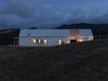 Modern home with Exterior, House Building Type, Prefab Building Type, Metal Roof Material, Gable RoofLine, A-Frame RoofLine, Wood Siding Material, and Farmhouse Building Type. Sustainbly constructed through a local prefabrication system, the Karangahake House earns its place within its beautiful natural New Zealand landscapes. Photo of Karangahake House