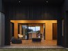 Modern home with Living Room, Painted Wood Floor, Bench, Ottomans, Light Hardwood Floor, Chair, Plywood Floor, Sofa, Medium Hardwood Floor, and Stools. Ambiguous and free flowing, the Outdoor Room is designed in the interstices of indoor and outdoor Photo of The Crest House