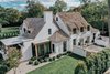 Modern home with Exterior, A-Frame RoofLine, Stucco Siding Material, Farmhouse Building Type, Shingles Roof Material, and House Building Type. Crafted by Michael Abraham Architecture. Photo 2 of Beautiful Belgian-inspired Farmhouse